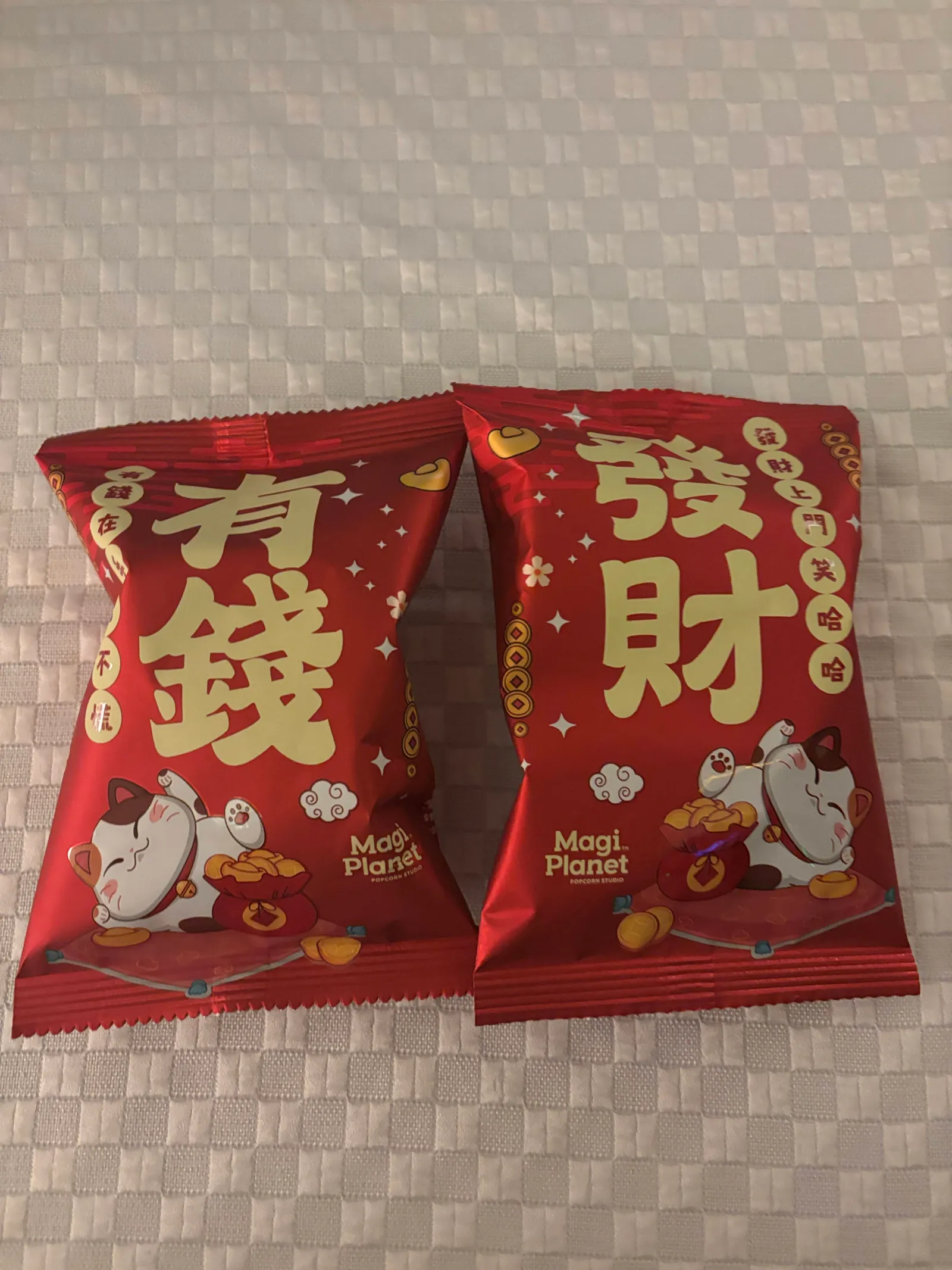 Magi Planet CNY popcorn in festive red packaging with lucky cat illustrations